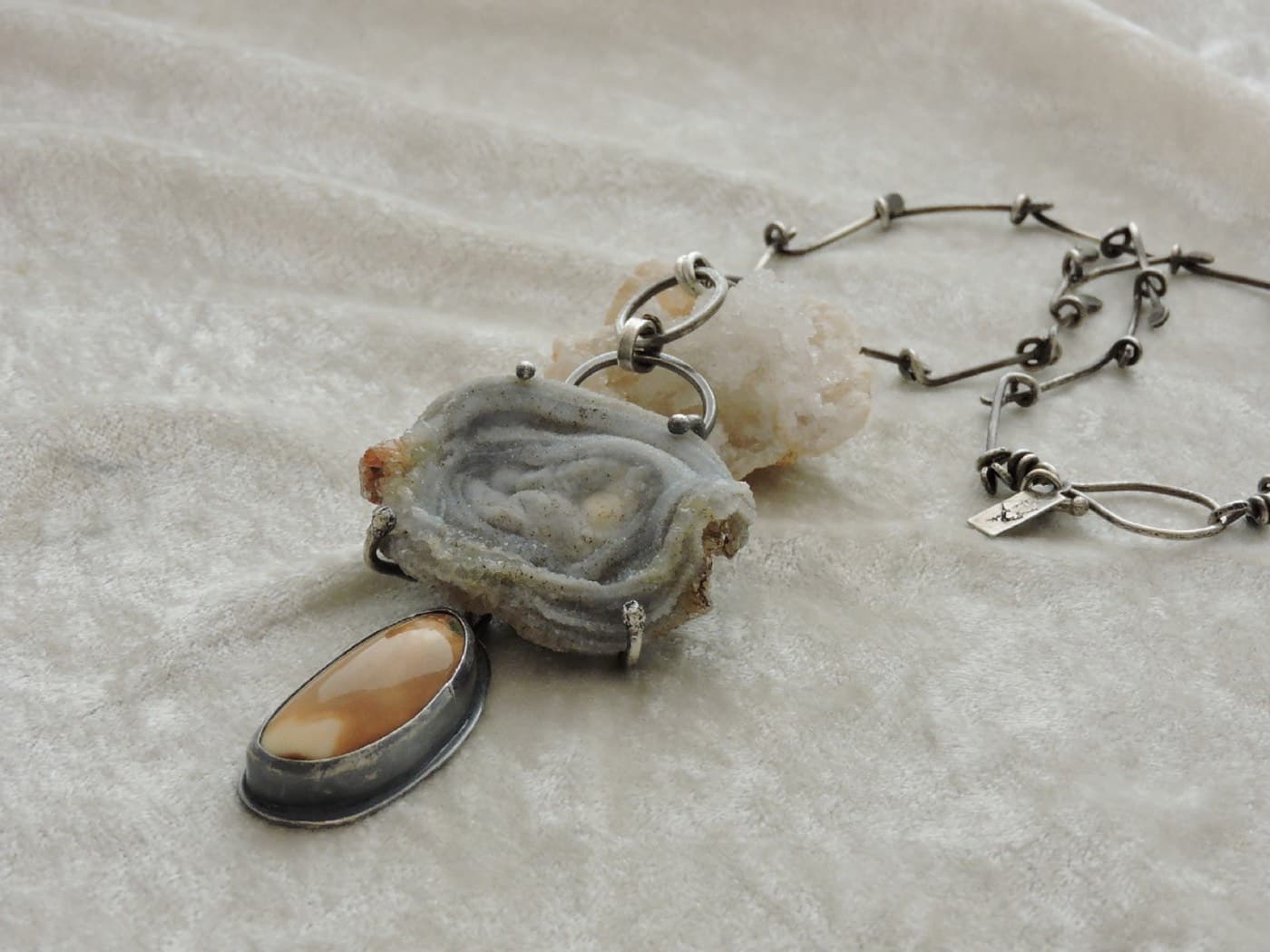 Captured druzy rose necklace with a petrified walrus tooth